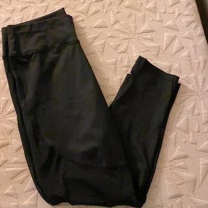 Never worn exercise leggings-black with mesh on calf area